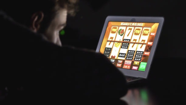 Mobile phone screen showing Hacksaw Gaming roulette table with betting interface and live video feed